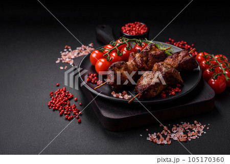 Delicious grilled chicken, turkey or pork skewers with salt, spices and herbs 105170360
