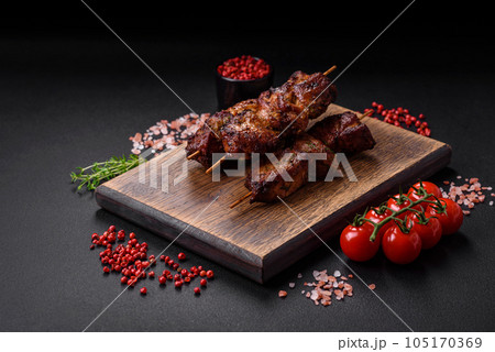 Delicious grilled chicken, turkey or pork skewers with salt, spices and herbs Delicious grilled chicken, turkey or pork skewers with salt, spices and herbs 105170369
