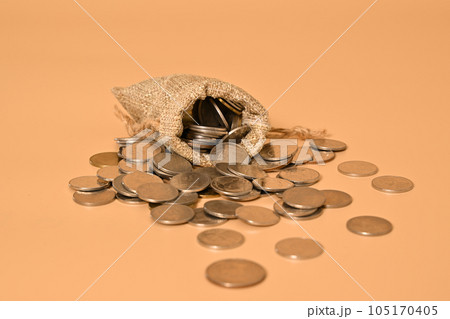 Money bag and stack of coins on background, Investment in future, Financial business investment, Growing money, People saving money, Money saving and financial banking Money bag and stack of coins on background, Investment in future, Financial business investment, Growing money, People saving money, Money saving and financial banking 105170405