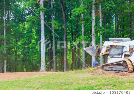 It is essential to move ground with bulldozer in order to carry out landscaping work 105176405