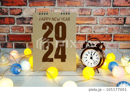 Happy New Year 2024 text message with alarm clock and LED cotton balls decoration 105177001