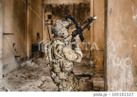 Expert team of soldiers with weapons attacking enemy 105181327