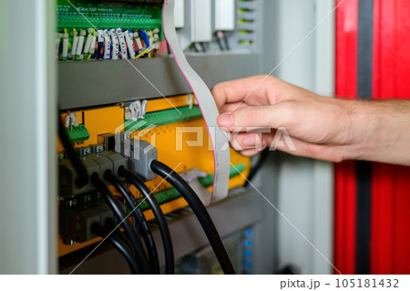 Professional male technician worker in white helmet checking machine maintenance Professional male technician worker in white helmet checking machine maintenance 105181432
