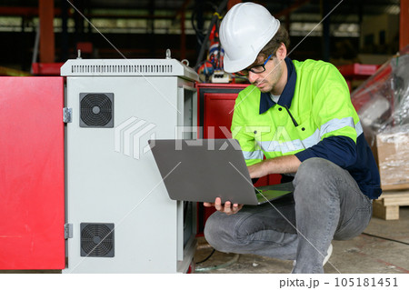 Professional male technician worker in white helmet checking machine maintenance Professional male technician worker in white helmet checking machine maintenance 105181451
