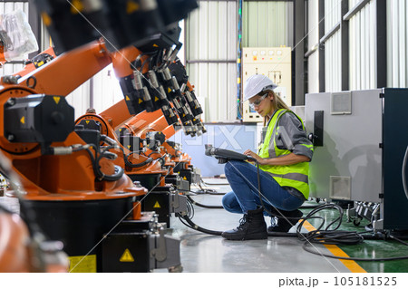Maintenance engineer worker working with robotic machine automation Maintenance engineer worker working with robotic machine automation 105181525