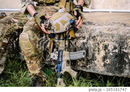 Smart teamwork of soldiers running forward and attacking enemy during military operation, Army soldiers in protective combat uniform, Soldiers with rifle, Soldiers with rifle on world war field 105181747