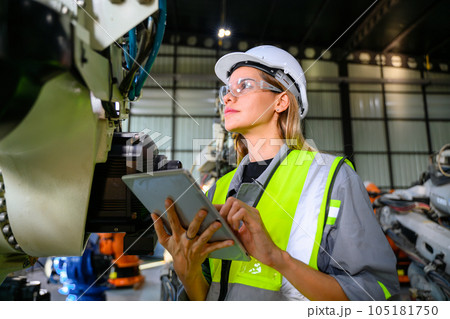 Female engineer worker working with robotic machine automation 105181750