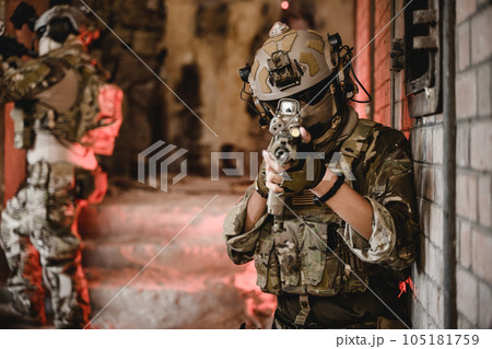Expert team of soldiers attacking enemy during military operation 105181759