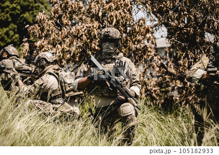 Soldiers running forward and attacking enemy during military operation Soldiers running forward and attacking enemy during military operation 105182933