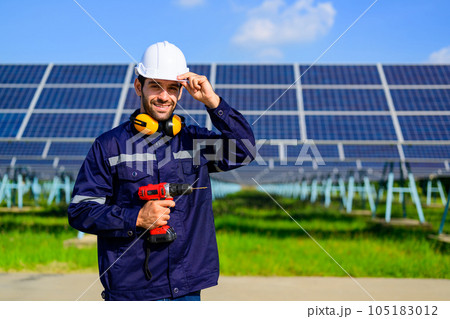 Engineer worker portrait with solar panel at solar farm Engineer worker portrait with solar panel at solar farm 105183012