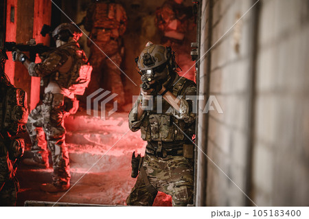 Expert team of soldiers attacking enemy during military operation 105183400