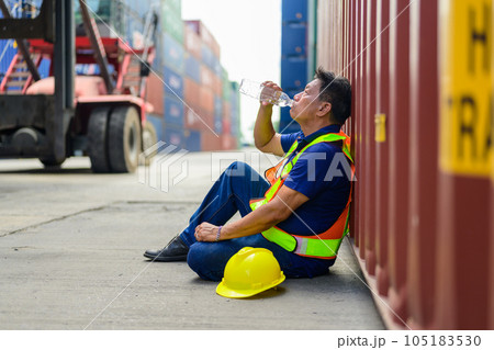 Warehouse engineer worker checking and working at industrial container station 105183530