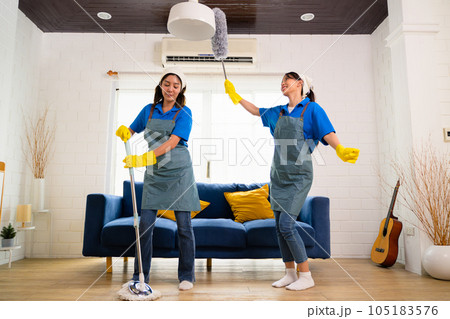 Couple of housekeeping staff cleaning house, Housekeeping and cleaning service, People doing housework at home 105183576