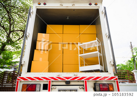 Cardboard boxes in car trunk, Delivery employees working with cardboard box at home of customer, Delivery service at home, Delivery truck with cardboard boxes, Online orders 105183592