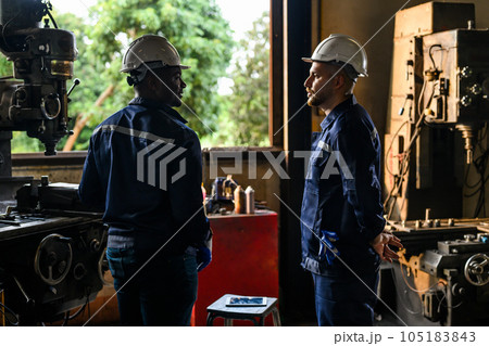 Professional mechanical engineer team checking and repairing engine machine Professional mechanical engineer team checking and repairing engine machine 105183843