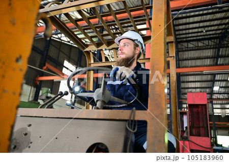 Mechanical engineer repairing engine machine at factory 105183960