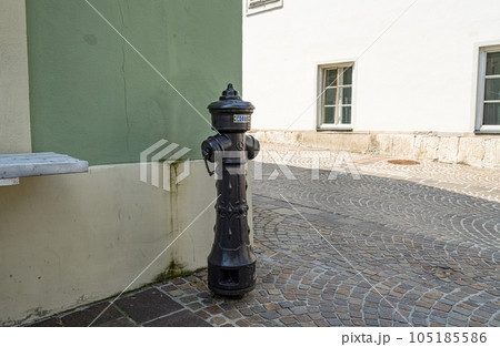 A fire hydrant on the sidewalk 105185586