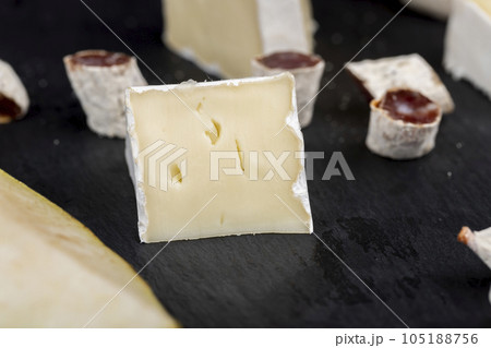 delicious sliced cheese with edible white mold 105188756