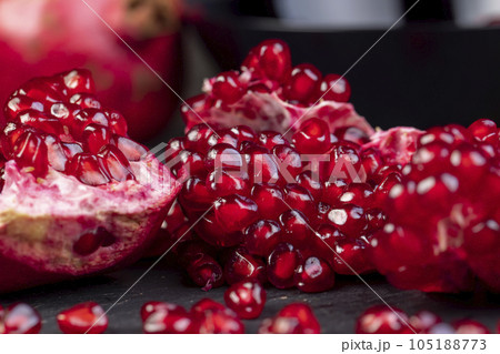 peeled red ripe pomegranate with red sweet grains 105188773