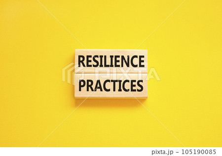 Resilience practices symbol. Concept word Resilience practices typed wooden blocks. Beautiful yellow table yellow background. Business and resilience practices concept. Copy space. 105190085