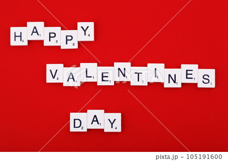 inscription Valentine's day and red hearts on a red background 105191600