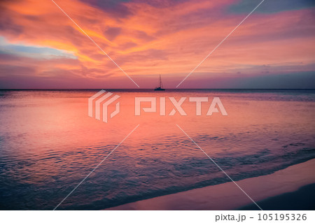 Palm Beach on Aruba island in the Caribbean Sea at dramatic sunset, Dutch Antilles Palm Beach on Aruba island in the Caribbean Sea at dramatic sunset, Dutch Antilles 105195326