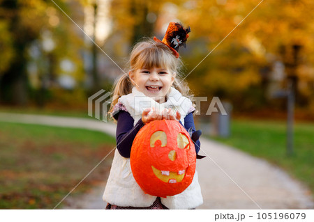 Little Preschool Kid Girl Holding Selfmade Traditional Lanterns with Candle for St. Martin Procession. Child Happy about Children and Family Parade in Kindergarten. German Tradition Martinsumzug. 105196079