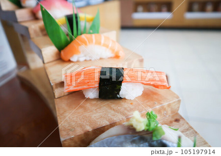 Crab stick roll or Kanikama roll and salmon roll Crab stick roll or Kanikama roll and salmon roll 105197914