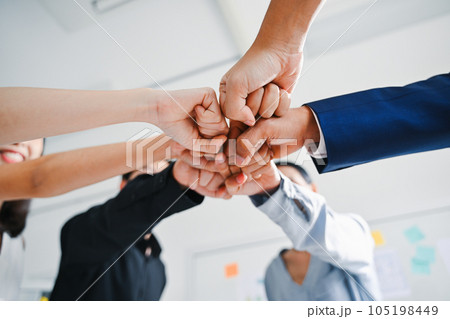 Professional group of business team stacking hands together with teamwork, Business people meeting and brainstorming together at modern office, People discussing and working in creative office Professional group of business team stacking hands together with teamwork, Business people meeting and brainstorming together at modern office, People discussing and working in creative office 105198449