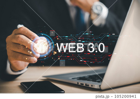 A businessman engrossed in his laptop embodies the essence of Web 3.0, symbolizing the integration of internet technology, futuristic concepts, and global business communication. web3 concept 105200941
