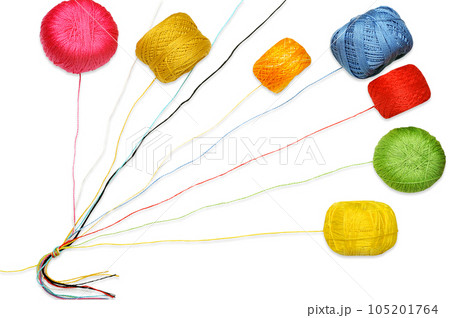 Multicolored knitting threads tied in a knot with a colorful yarn balls 105201764