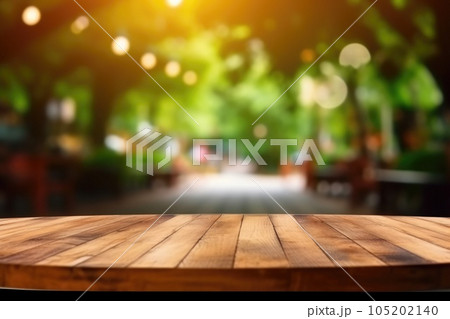 The empty wooden table top with blur background of outdoor cafe. Exuberant. The empty wooden table top with blur background of outdoor cafe. Exuberant. 105202140