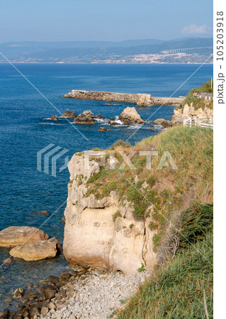 View of coastline in southern Italy. Scenic view from on top cliff looking out to sea. Calabria coastline with eroded cliff View of coastline in southern Italy. Scenic view from on top cliff looking out to sea. Calabria coastline with eroded cliff 105203918