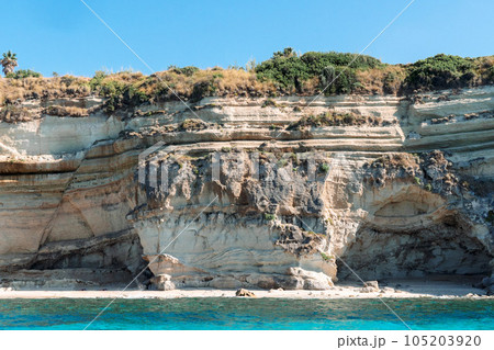 View of coastline in southern Italy. Scenic view from the boat on sunny summer day. Calabria, Scilla shore View of coastline in southern Italy. Scenic view from the boat on sunny summer day. Calabria, Scilla shore 105203920