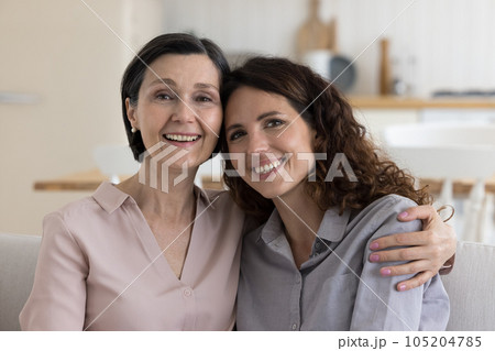 Happy black haired mature mother and daughter woman head shot 105204785