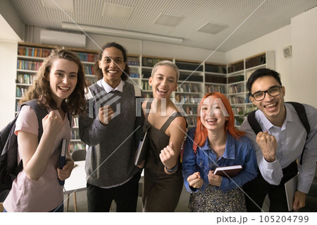 Cheerful excited high school mates celebrating educational achievement Cheerful excited high school mates celebrating educational achievement 105204799
