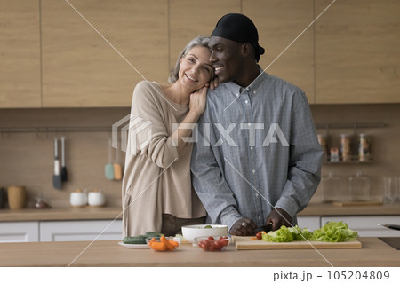 Cheerful cute diverse mature couple keeping healthy lifestyle Cheerful cute diverse mature couple keeping healthy lifestyle 105204809