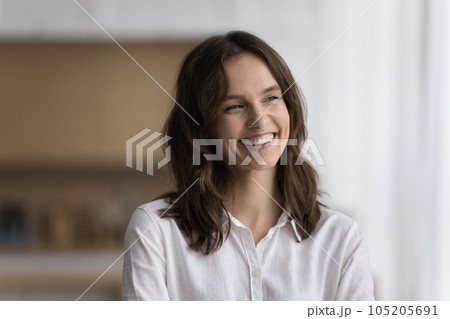 Head shot portrait beautiful woman standing alone smile looking aside Head shot portrait beautiful woman standing alone smile looking aside 105205691