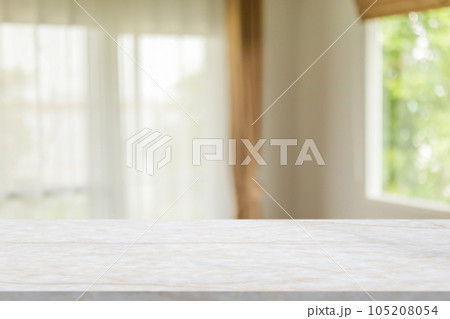 Marble table with blur room interior with window curtain background Marble table with blur room interior with window curtain background 105208054