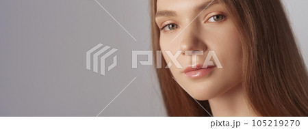 Perfect skin. Face wellness. Facial cosmetics. Beautiful flawless confident smiling fair hair woman with natural makeup isolated on beige background empty space. Perfect skin. Face wellness. Facial cosmetics. Beautiful flawless confident smiling fair hair woman with natural makeup isolated on beige background empty space. 105219270