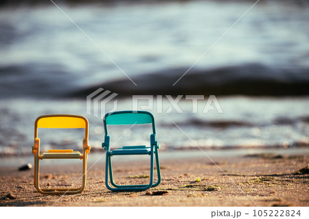 Two chairs by the sea. The concept of outdoor recreation. Beach chairs provide an opportunity to enjoy solitude with nature, surrounded by the beauty of the sea coast. 105222824