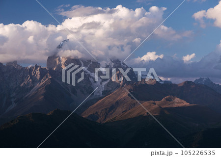 Beautiful mountain peak in the clouds 105226535