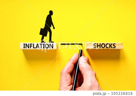 Inflation shocks symbol. Concept words Inflation shocks on wooden blocks. Beautiful yellow table yellow background. Businessman hand. Businessman icon. Business inflation shocks concept. Copy space. Inflation shocks symbol. Concept words Inflation shocks on wooden blocks. Beautiful yellow table yellow background. Businessman hand. Businessman icon. Business inflation shocks concept. Copy space. 105226818