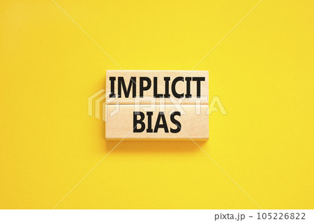 Implicit bias symbol. Concept words Implicit bias on wooden block. Beautiful yellow table yellow background. Business psychology implicit bias concept. Copy space. Implicit bias symbol. Concept words Implicit bias on wooden block. Beautiful yellow table yellow background. Business psychology implicit bias concept. Copy space. 105226822