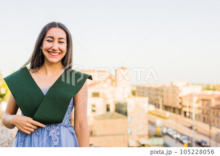Education college graduate, happy student. Hispanic woman in Salamanca, Spain, outdoors smiling Education college graduate, happy student. Hispanic woman in Salamanca, Spain, outdoors smiling 105228056
