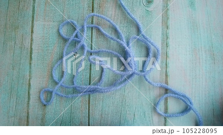 Blue, white crochet elements and orchid. Crochet texture, place for an inscription, adapted for mobile phone Blue, white crochet elements and orchid. Crochet texture, place for an inscription, adapted for mobile phone 105228095