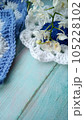 Blue, white crochet elements and orchid. Crochet texture, place for an inscription, adapted for mobile phone 105228102