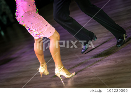 Legs of young dancers on the dance floor Legs of young dancers on the dance floor 105229096