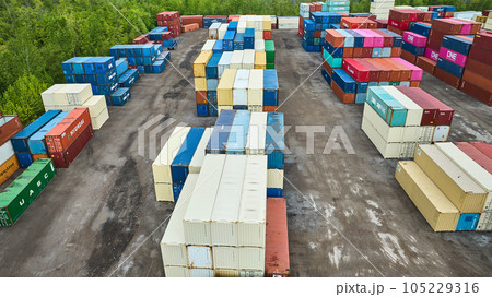 White chalk pastel shipping containers and other colors in shipping yard aerial White chalk pastel shipping containers and other colors in shipping yard aerial 105229316