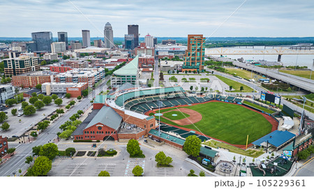 Downtown skyscraper background with white gold truss bridge over river near Louisville Slugger Field Downtown skyscraper background with white gold truss bridge over river near Louisville Slugger Field 105229361